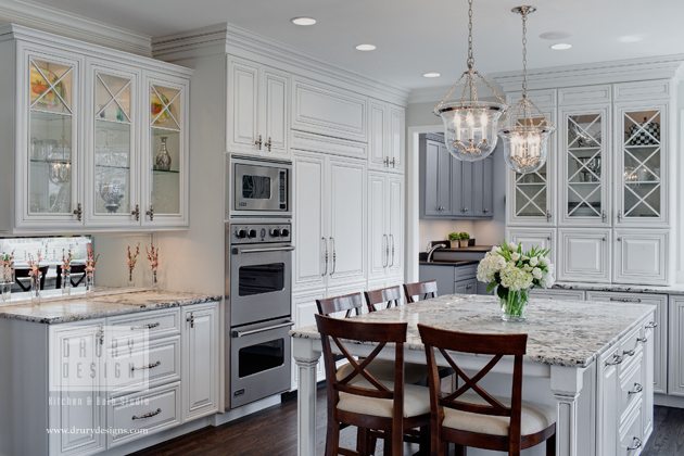 White Glen Ellyn kitchen with white and grey granite countertops and bar