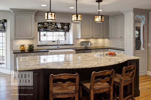 Large light colored granite island with beautiful dark veins 