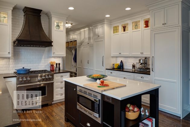 Transitional kitchen design by Drury Design with white cabinets