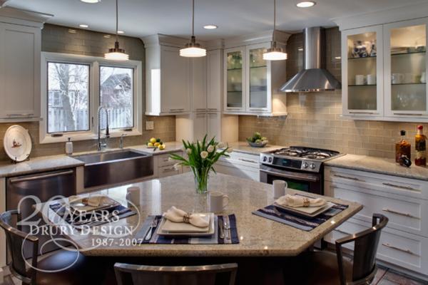 Soft white cabinetry, subway tiles, and a larger window all helped to create thi