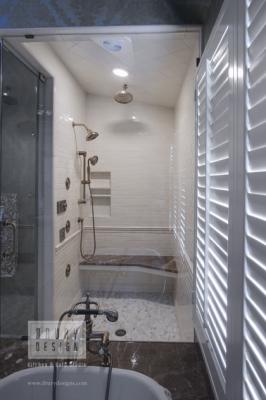 Recent Drury Design master bath remodel featuring a spacious steam shower enclosure adjacent to tub deck