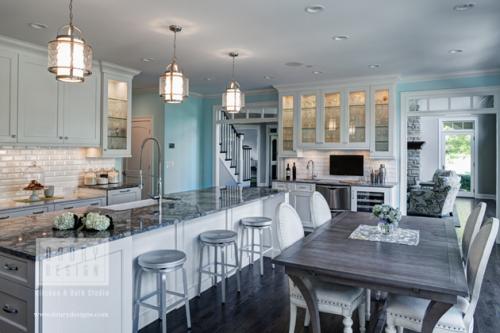 Remodeled Kitchen with White cabinets and white brick backsplash