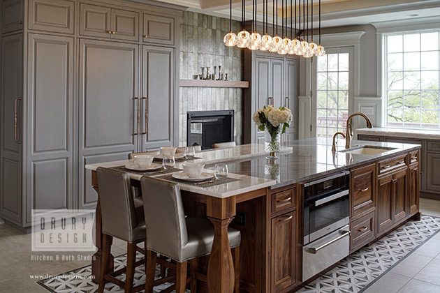 Transitional kitchen design with gran countertops and cabinets by Drury Design