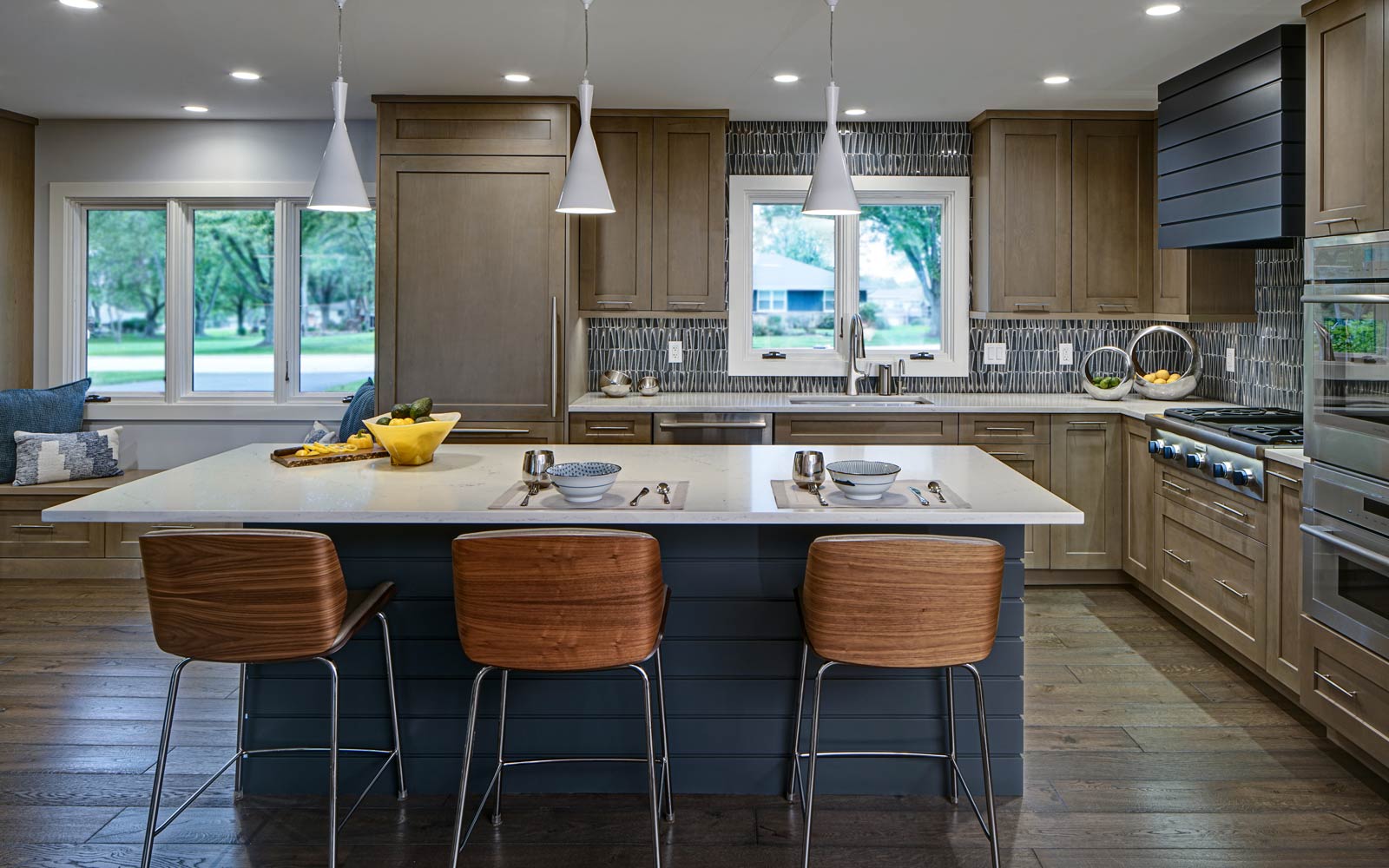 This redesigned kitchen utilizes colorful palette of materials and textures.