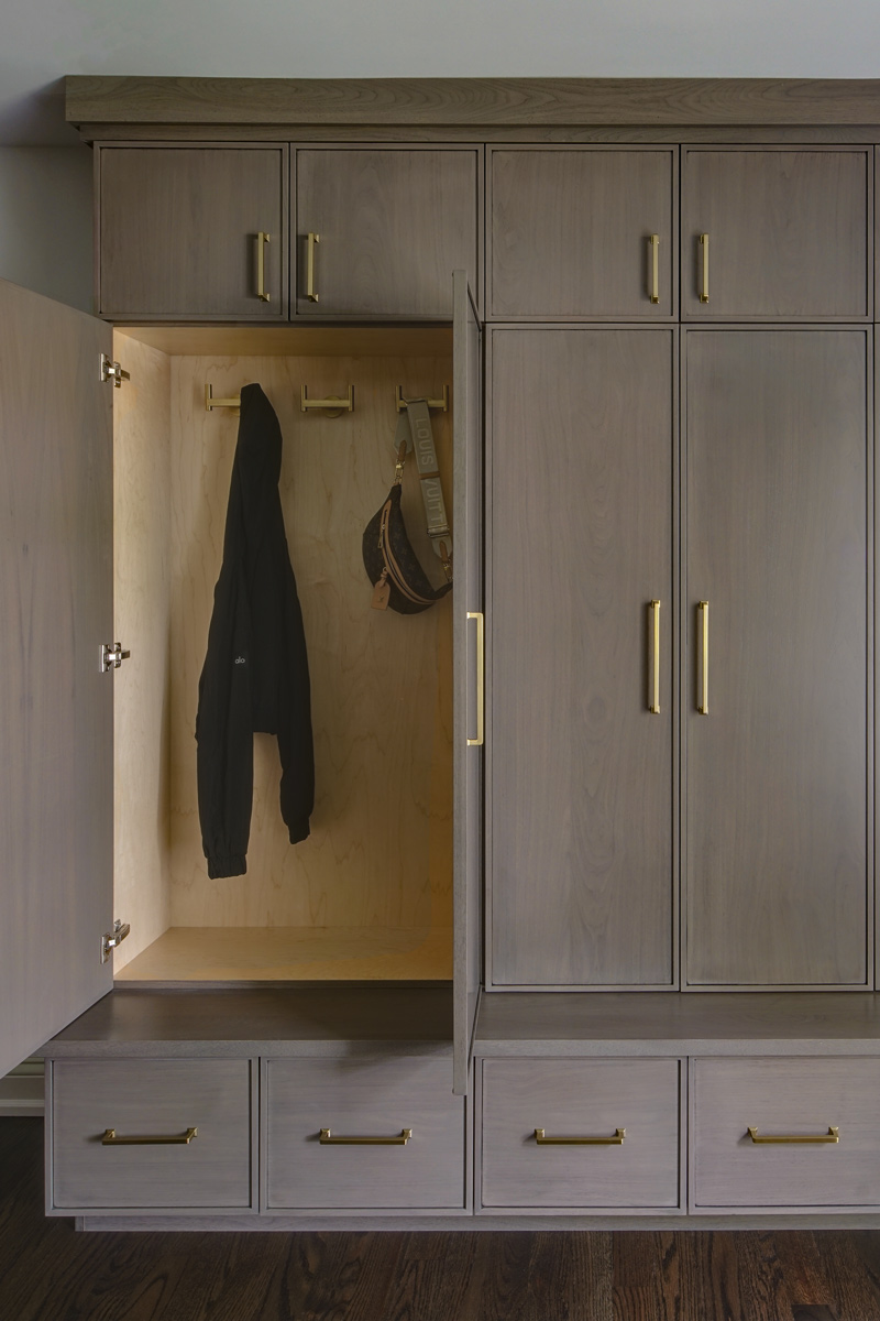 Family-Command-Center-Mudroom_Drury-Design_Copyright-2026_Coat-Storage-hooks-open-door_800